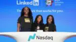 Naperville native logan white stands alongside two of her LinkedIn colleagues for a picture after the company rang the Nasdaq closing bell.