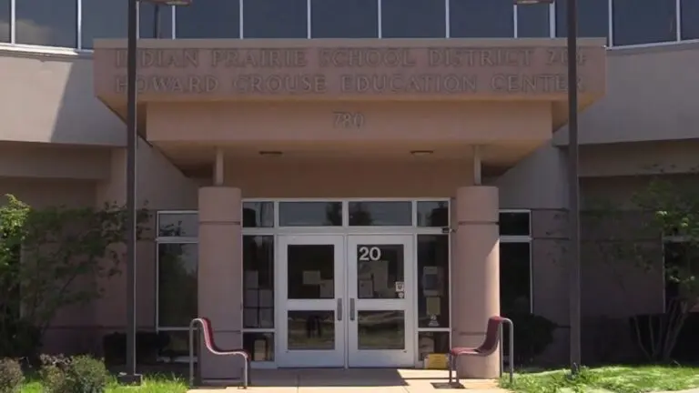 Exterior image of IPSD 204 administration building focused on the front entrance and sign