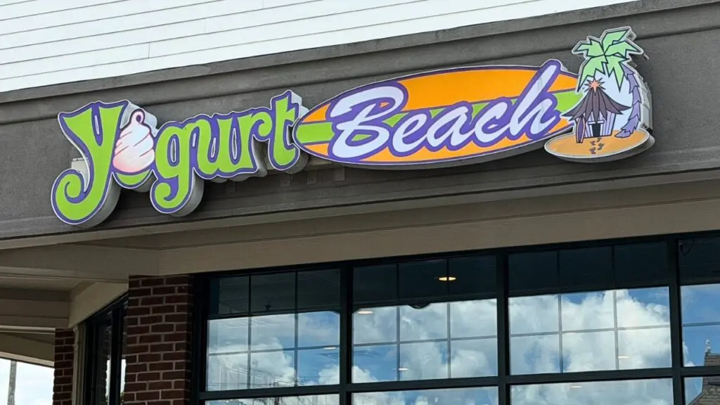 Close up of Yogurt Beach Naperville location sign