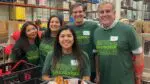 A group of Duly volunteers wearing shirts with #DulyGooder on the front.