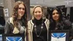 Two students hold their Youth Service Awards with Nina Menis, the executive director of KidsMatter.