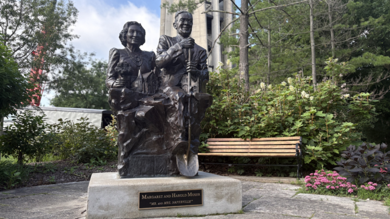 Mr and Mrs Naperville statue in front of Moser Tower