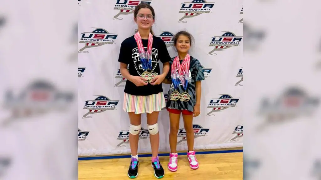 Sameera and Sasha Rai pose for a photo together with their medals.