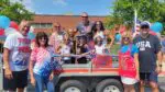 A Brookdale family poses on their Fourth of July Parade float.