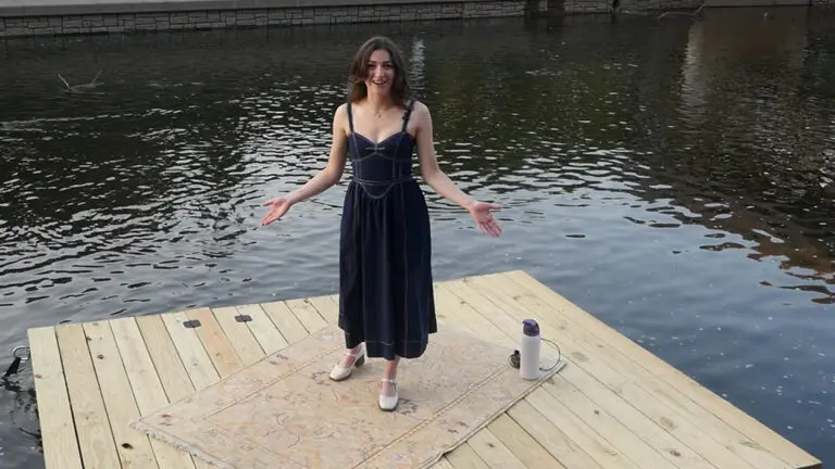 Professional singer Chloe Hayes sings on a floating stage in middle of the DuPage River downtown Naperville