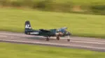 A model plane speeds down the runway at the Springbrook Prairie Model Aircraft Flying Field.