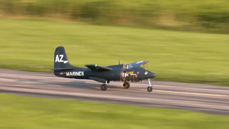 A model plane speeds down the runway at the Springbrook Prairie Model Aircraft Flying Field.