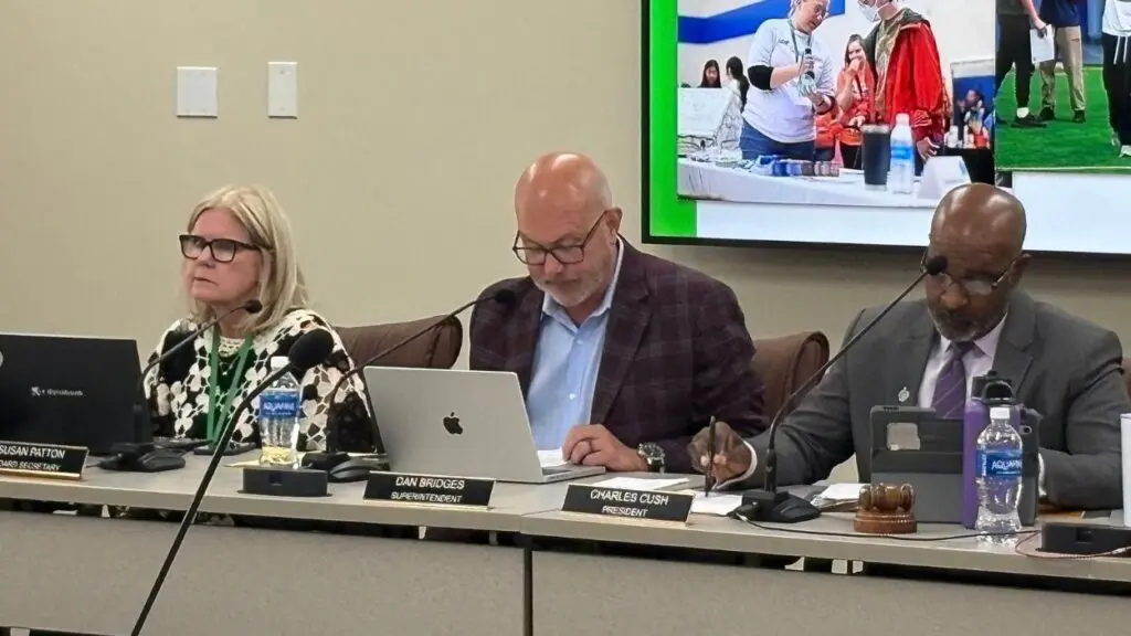 Susan Patton, Dan Bridges, and Charles Cush at Naperville 203 board meeting