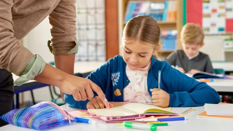 Close up of student with a teacher helping