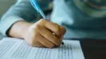 Close up of student filling in test paper bubbles