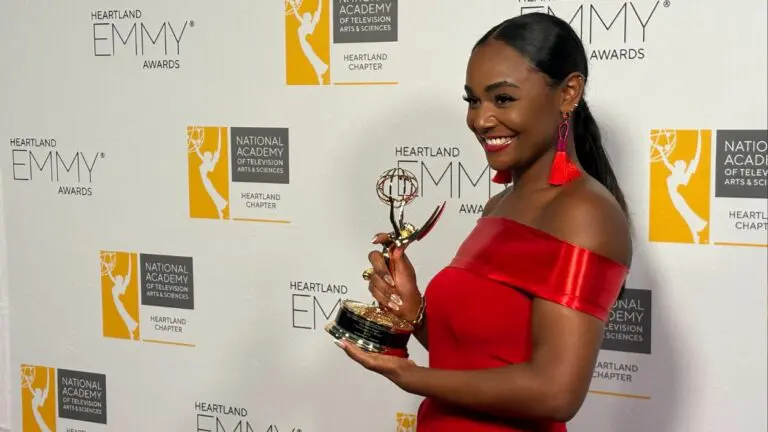Reporter Janelle Finch poses for photo with Emmy Award