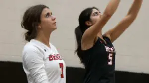 Benet girls volleyball players warming before playing Metea