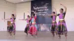A performance group dances on stage at the first-ever Naperville International Festival