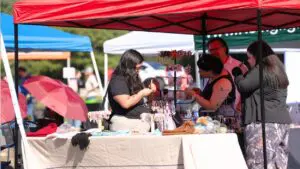 A vendor sells items to customers at the 2026 All Abilities Vendor Fair.