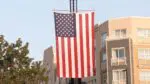 Close up of American flag hanging on crane for Naperville Sept. 11 remembrance ceremony