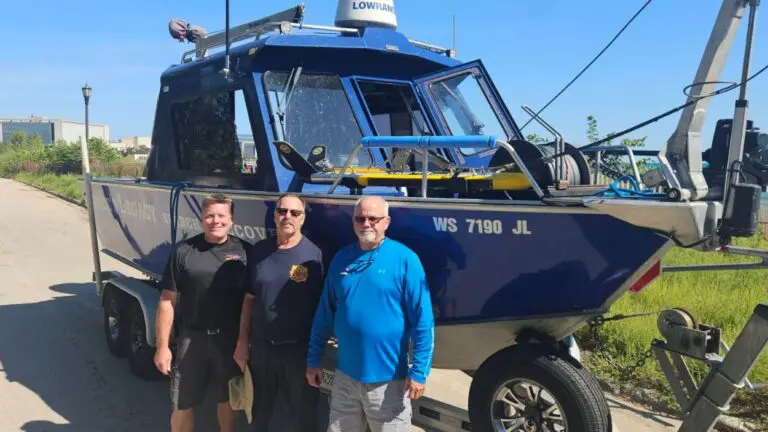 Bruce's Legacy team in front of recovery boat