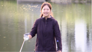 A Neuqua Valley girls golfer smiles for the camera.