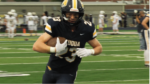 Neuqua Valley football player carries the football.