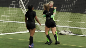 Julia Straub hugging one of her teammates.