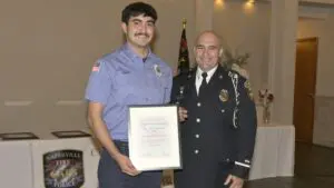 Cadet of the Year Carlos Reyes with another fire department member
