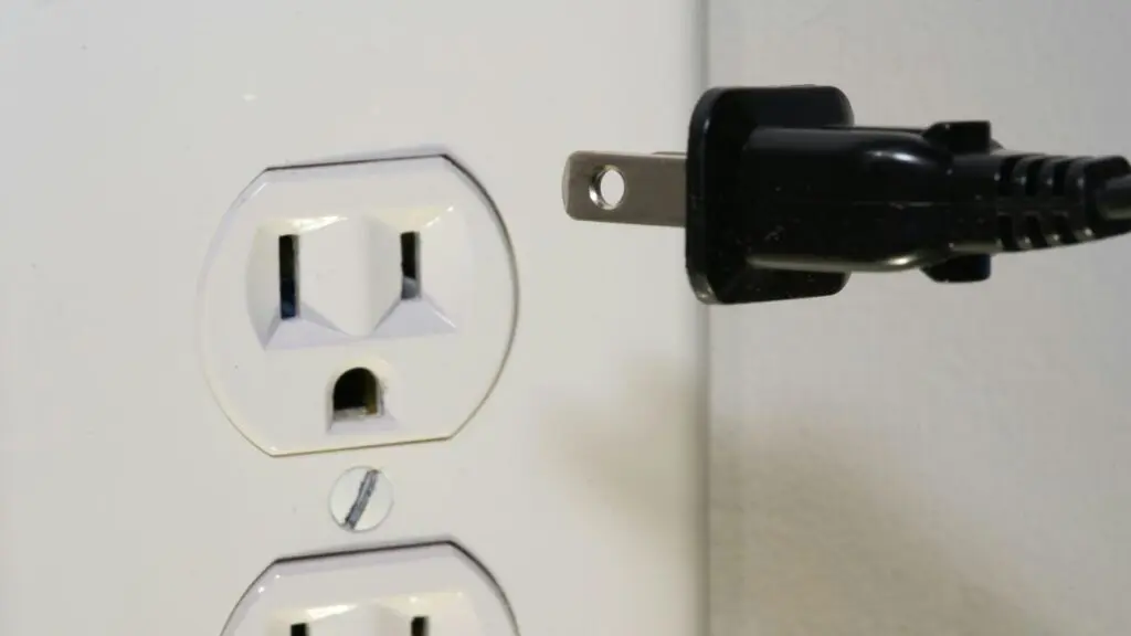 Close up of plug and outlet
