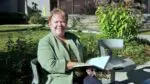 Dawn Portner sits outside city hall