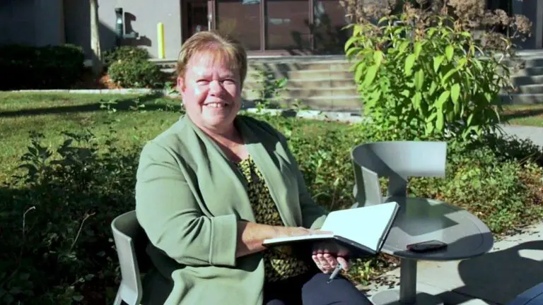 Dawn Portner sits outside city hall