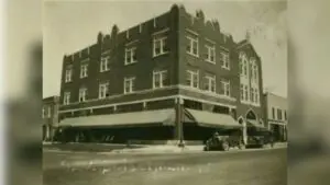 Historic Biedelman building photo before windows were boarded up and roof line was simplified. Photo courtesy Naper Settlement Research Library and Archives.