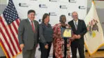 The Governor and staff at IPSD 204 pose for a picture
