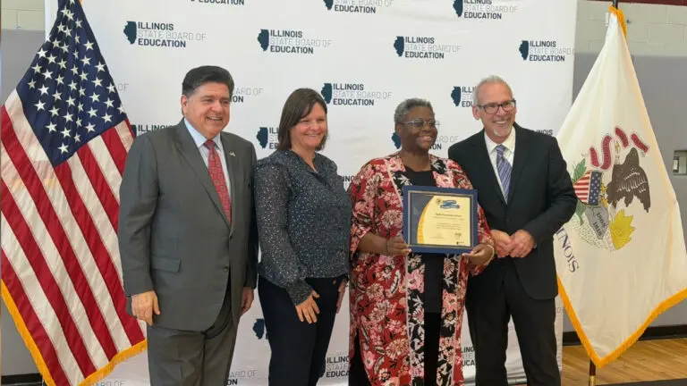 The Governor and staff at IPSD 204 pose for a picture