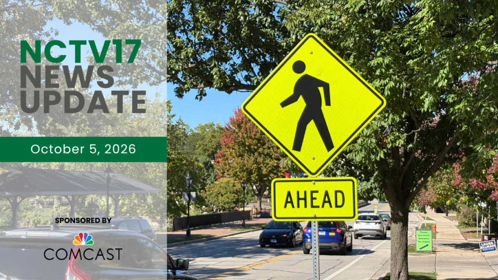 Crosswalk sign with news update graphic