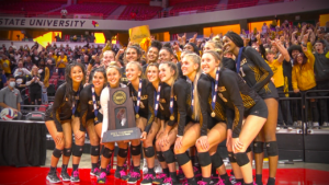 Metea girls volleyball poses with the 2021 state trophy.