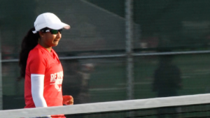 Shavi Wijesinghe chases a ball down on the court.