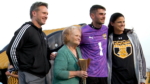 Chase Grosrenaud gets a photo with his family on Senior Night.