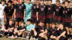 Benet boys soccer poses for photo with the regional champions plaque.