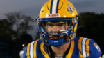 Lyons Township quarterback takes snaps in warmups.