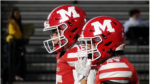 A pair of Marist players prepare for warmups.