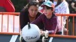 mom and son prepare to launch their pumpkin on the race ramp