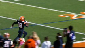 Vic Tyson struts up the sideline for an 80 yard touchdown.