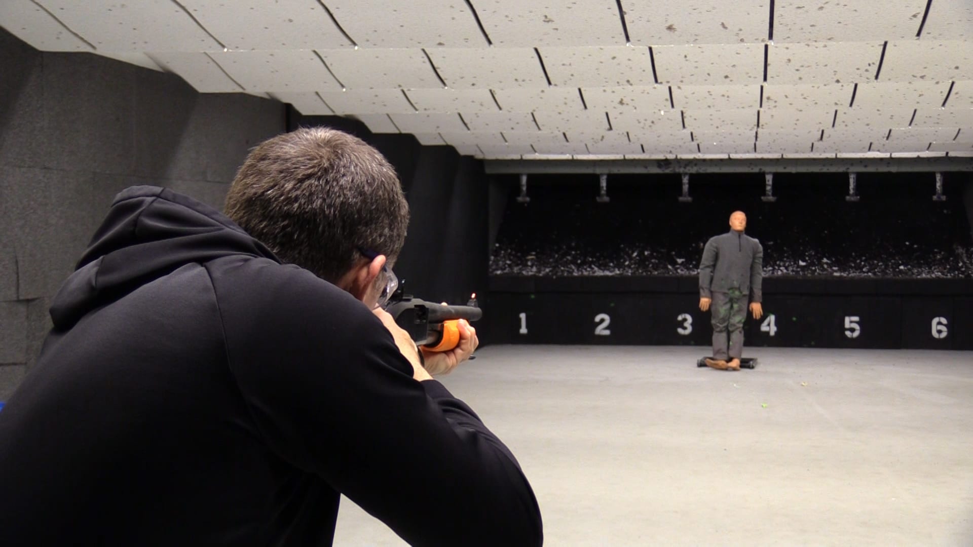 Man shooting in gun range.