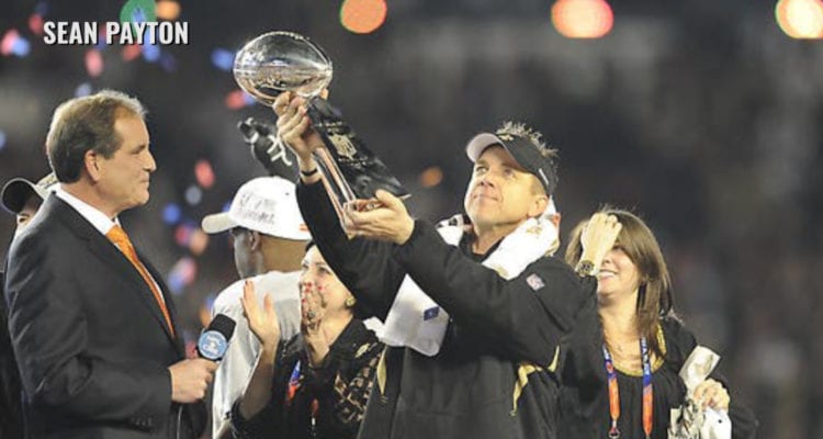 Sean Payton holding Super Bowl trophy