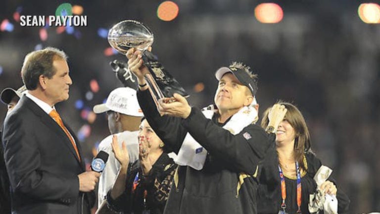 Sean Payton holding Super Bowl trophy