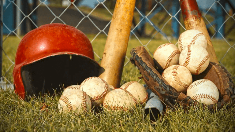 Baseballs, mits, bats, and helmet