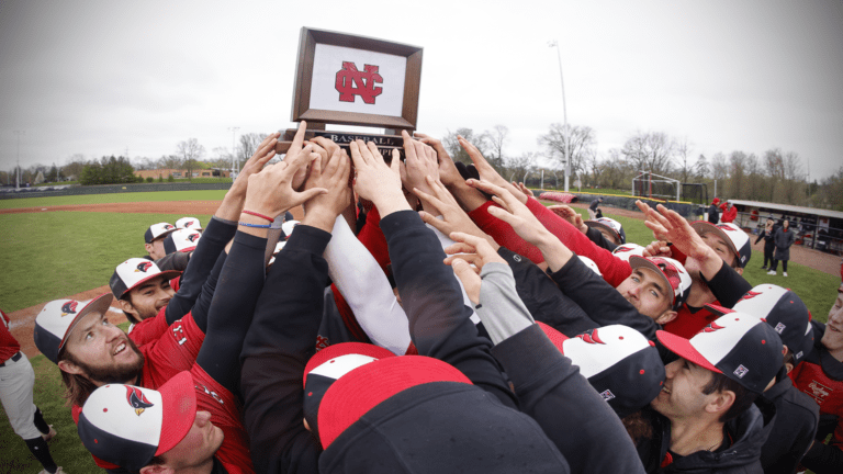 North Central baseball players celebrate being conference champions