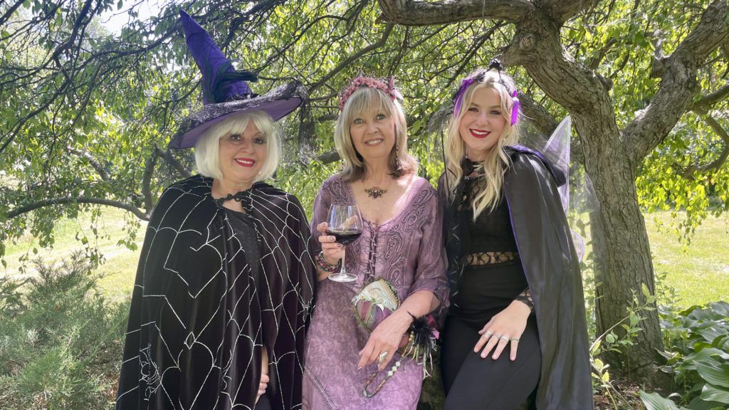 Three witches enjoying Naperville Woman's Club Witches Night Out event