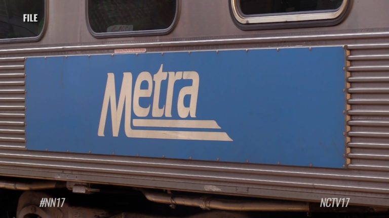 Metra Sign on side of Metra train car