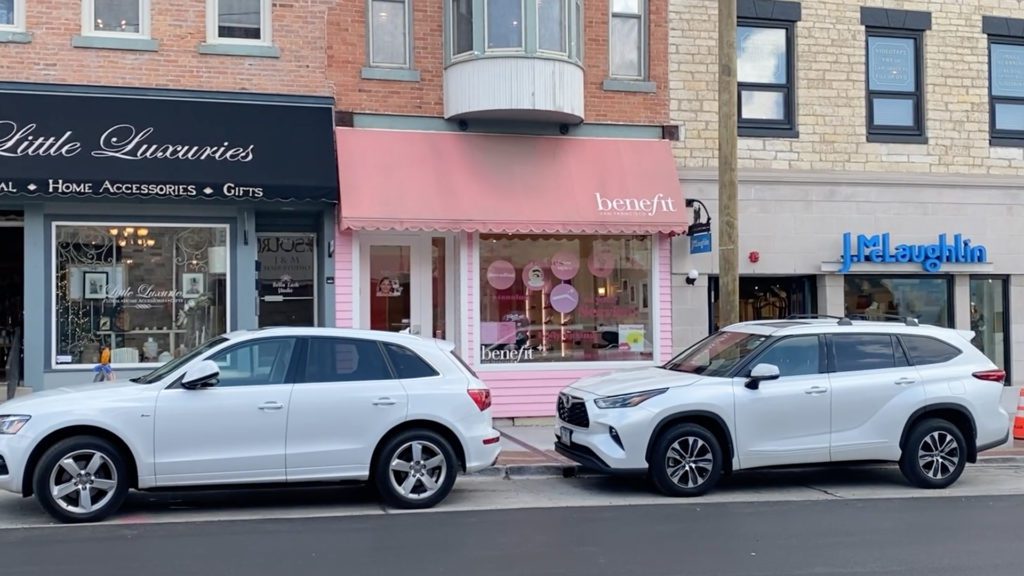 wide shot of three storefronts in downtown Naperville