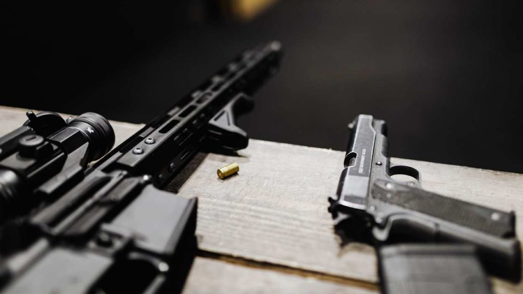 stock image of two guns