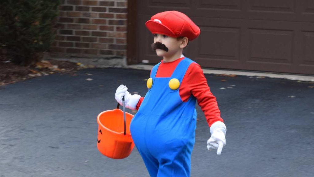 Little boy in Mario costume on Halloween