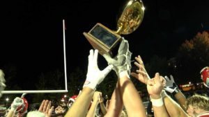 Naperville Central celebrates Crosstown Classic with trophy